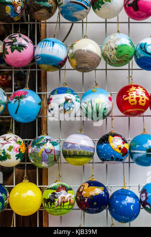 Hanging christmas tree decorations (baubles) on sale in Chinatown, Singapore Stock Photo