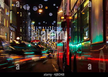 LONDON, UK - November 17th, 2017: Christmas lights on Oxford Street; seasonal lights are being displayed over busy shopping area of central London. Stock Photo