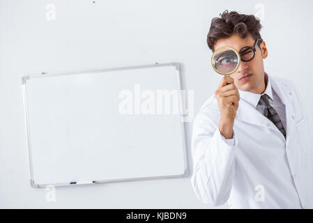 Funny doctor scientist making presentation in hospital Stock Photo