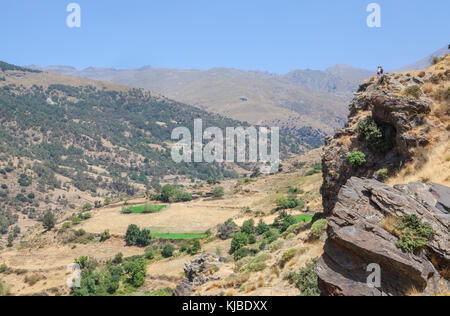 Hiking couple along Poqueira Gorge. Las Alpujarras Region, Granada, Spain Stock Photo