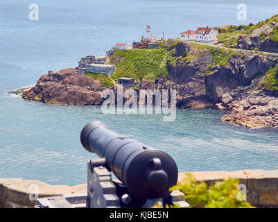 Fort Amherst lighthouse with Queens Battery cannon, coastal gun battery established in 1796 on Signal Hill, St John's, Newfoundland, Canada Stock Photo