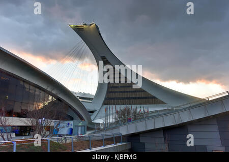 The Montreal Olympic Stadium and tower at sunset. It's the tallest inclined tower in the world.Tour Olympique stands 175 meters tall and at a 45-degre Stock Photo
