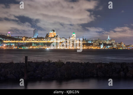 View of Quebec City from Levis at twilight with the famous Frontenac Castle, a hotel which dominates the skyline and the ramparts surrounding the old  Stock Photo