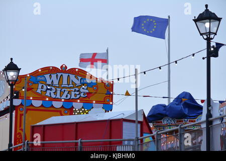 Flags on Paignton Pier on a windy day, Paignton, Devon, UK Stock Photo
