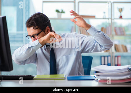 Businessman suffering from excessive armpit sweating Stock Photo