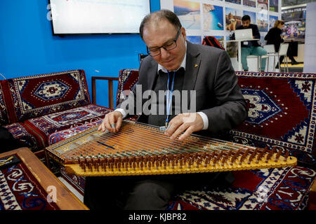 Turkish man plays qanun, traditional regional instrument at the COP23 Fiji panel in Bonn, Germany on the 15th of November 2017. COP23 is organized by  Stock Photo