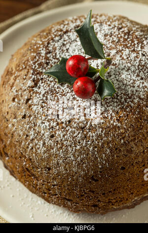 Sweet Homemade Christmas Figgy Pudding with Powdered Sugar Stock Photo