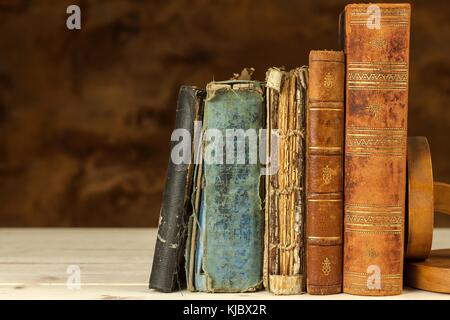 Old books on wooden shelf. Studying at the University from old Books. Place for text Stock Photo