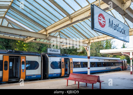 East Midlands Trains train with the doors open waiting to depart from Matlock Railway Station, Derbyshire, England, UK Stock Photo