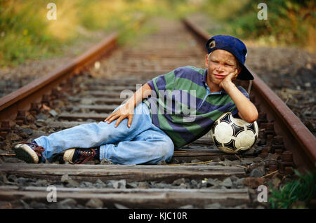 Boy posing near railway track - PixaHive