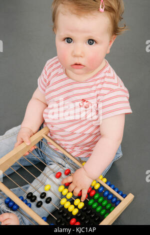 Baby with Abacus Stock Photo