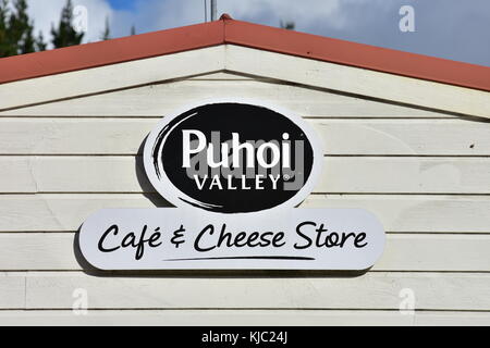 Wooden wall sign of Cafe and Cheese Factory in Puhoi near Auckland. Stock Photo