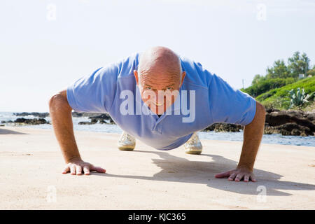 Man Doing Push-ups Outdoors Stock Photo