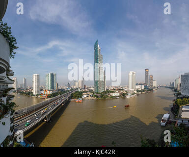 Krung Thon Buri Road, King Taksin Bridge over the Chao Phraya River, iconic skyscrapers from the west bank Khlong San district, Bangkok, Thailand Stock Photo