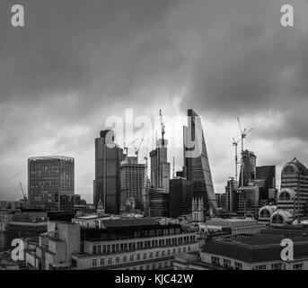 City of London, London, UK, 26th October 2017.  Dark clouds gather over iconic modern buildings on the skyline of the financial and insurance district Stock Photo
