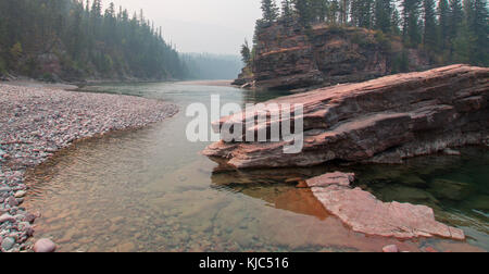 Fly fishing at the confluence of the Flathead and Spotted Bear Rivers in the Bob Marshall wilderness area during the 2017 fall fires in Montana United Stock Photo