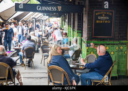 Sydney market at The Rocks and drinkers at the Mercantile hotel in George street,Sydney,Australia Stock Photo