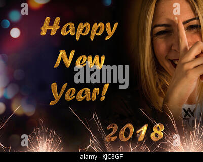 Nice and funny blonde girl wishes you a happy new year 2018 Stock Photo