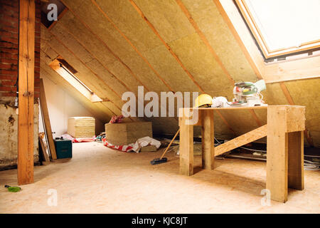 house attic under construction mansard wall insulation Stock Photo