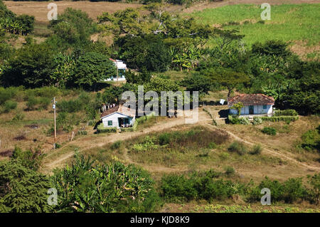 Small houses and fields in Valle de los Ingenios landscape, near Trinidad, Cuba Stock Photo