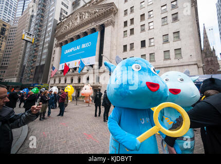 Actors dressed as mascots (with their handlers) parade and pose for photos in front of New York Stock Exchange for the first day of trading for the Chinese fintech firm Jianpu Technology initial public offering, on Thursday, November 16, 2017. Jianpu charges fees for its loan products and credit card recommendations. (© Richard B. Levine) Stock Photo