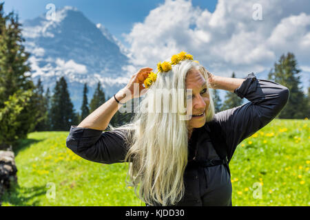 Caucasian woman wearing crown of flowers Stock Photo