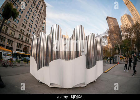 Visitors to Flatiron Plaza in New York on Tuesday, November 21, 2017 interact with 'Flatiron Reflection' designed by the design firm Future Expansion. The Christmas installation is the centerpiece of the Flatiron 23rd Street Partnership's  holiday programming.  (© Richard B. Levine) Stock Photo