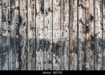 Vintage wooden background from brown planks with knots. Decorative striped background from old weathered boards. Stock Photo