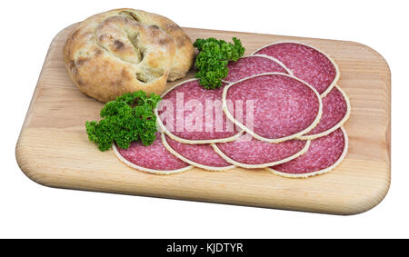 Hearty snack on cutting board. Spicy salami and olive bread with parsley garnish. Isolated on white background. Stock Photo
