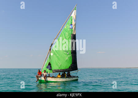 Boys in a sailboat off of Magaruque Island, formerly Ilha Santa Isabel, is part of the Bazaruto Archipelago, off the coast of Mozambique. Stock Photo