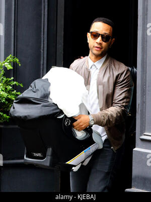 NEW YORK, NY - MAY 17: John Legend and new daughter Luna as they leave their apartment on May 17, 2006 in New York City.   People:  John Legend, Luna Legend Stock Photo