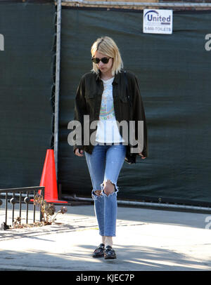 LOS ANGELES, CA - JULY 05: Emma Roberts cuts a stylish figure in distressed denim during solo shopping trip in LA. The 25-year-old actress opted for a white t-shirt decorated with a colorful image of an Egyptian pharaoh, which she paired with cropped denim jeans that were ripped at the knees on July 5, 2016 in Los Angeles, California.  People:  Emma Roberts Stock Photo