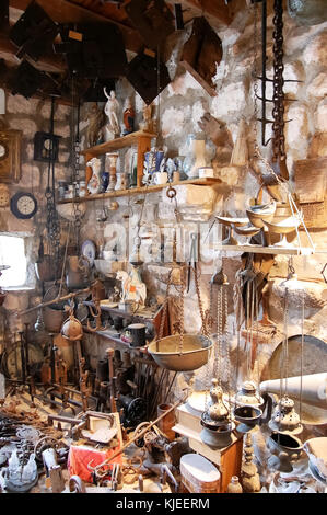 Variety of old household items collected in church of Our Lady of the Rocks on the island in Kotor Bay as a gift, Montenegro. Stock Photo