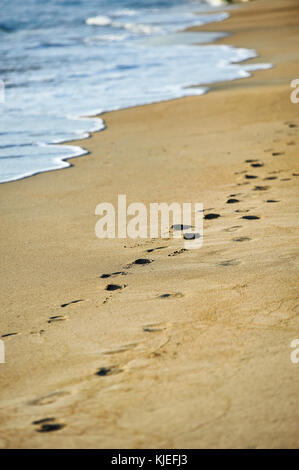 Human footprints on the Italian beach - relax and holiday travel concept Stock Photo