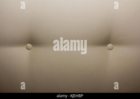 Light coloured leather sofa with two buttons texture Stock Photo