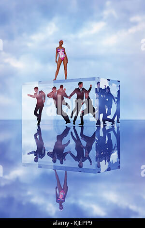 Robot woman standing on cube with businessmen trapped inside Stock Photo