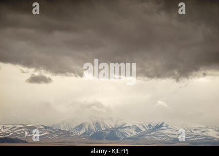 Storm clouds over mountain landscape Stock Photo