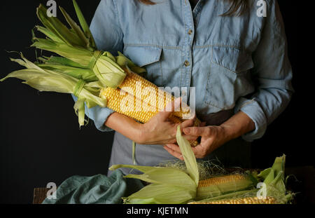 Close up of Caucasian woman holding corn Stock Photo
