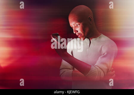 Man texting on cell phone Stock Photo