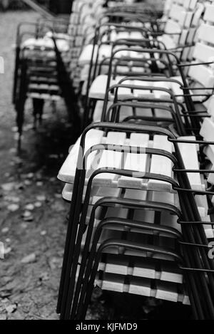 Raw of chairs with armrests. Black and white abstract photo Stock Photo