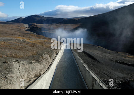 Waterfall flowing into Hafrahvammagljufur canyon from Karahnjukar Hydropower Plant (Kárahnjúkavirkjun), Fljótsdalshérað municipality, East Iceland Stock Photo