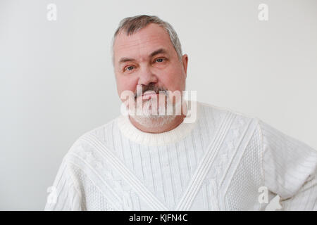 Middle aged bearded man looking at camera smiling Stock Photo