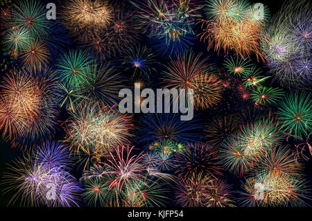 Abstract background of multicolored fireworks on the black background. Can be used as wallpaper. Stock Photo