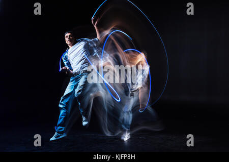 Happy well built man practicing his dance Stock Photo