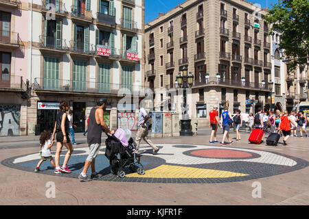 BARCELONA, SPAIN - SEPTEMBER 2: Joan Miro's Pla de l'Os mosaic in La Rambla on September 2, 2017 in Barcelona, Spain. Thousands of people walk daily o Stock Photo