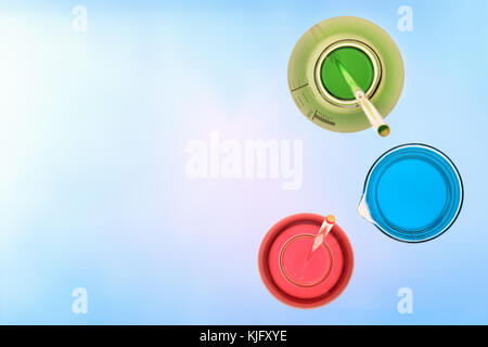 Chemical laboratory glassware with beaker and flasks filled with stirring rod and colored liquid. Top view. Stock Photo