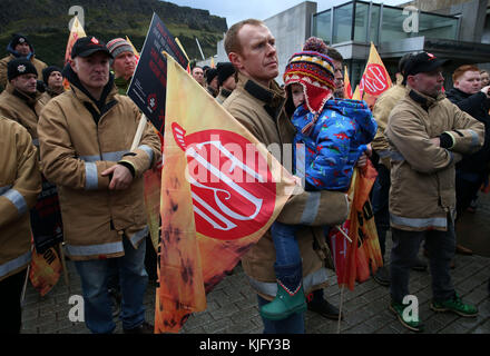 Firefighters listen to Scottish Labour leader Richard Leonard as he addresses firefighters at a Fire Brigade Union Scotland rally outside the Scottish Parliament in Edinburgh. Stock Photo