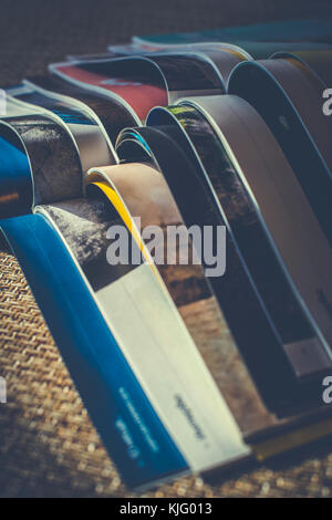 Many opened journals. Sun light. Stock Photo