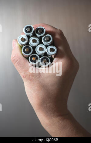 Hand hold many batteries. Close up Stock Photo