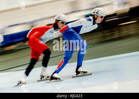 skaters compete in two women mass start during Cup in speed skating Stock Photo